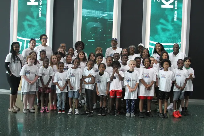 Magic of Literacy scholars and chaperones posing for a group photo at the Breslin Center